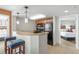 Functional kitchen with breakfast bar, appliances, and a view into the bedroom at 5200 N Ocean Blvd. # 957, Myrtle Beach, SC 29577