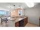 Modern kitchen featuring granite countertops, a breakfast bar, and seamlessly connected to the dining and living areas at 5200 N Ocean Blvd. # 957, Myrtle Beach, SC 29577