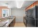 Well-designed kitchen offering sleek appliances, granite counters, ample cabinet space, and an adjacent breakfast bar at 5200 N Ocean Blvd. # 957, Myrtle Beach, SC 29577