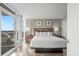 Serene main bedroom features floor-to-ceiling windows, a comfortable king-sized bed, and stylish furnishings at 5200 N Ocean Blvd. # 957, Myrtle Beach, SC 29577
