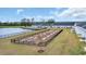 Community garden plot near pond with community resident homes in the background at 564 Sea Sparrow St. # 564, Myrtle Beach, SC 29588