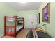 Cozy bedroom with bunk beds, a desk, and neutral green walls at 570 Botany Loop Murrells Inlet # 570, Murrells Inlet, SC 29576