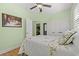 Serene bedroom featuring a floral bedspread, closet, and calming green walls at 570 Botany Loop Murrells Inlet # 570, Murrells Inlet, SC 29576