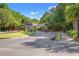 Welcoming entry gate surrounded by mature trees and landscaping offers a secure entrance to the community at 570 Botany Loop Murrells Inlet # 570, Murrells Inlet, SC 29576