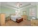 Serene main bedroom features tray ceiling, ceiling fan, plantation shutters, and stylish furniture at 570 Botany Loop Murrells Inlet # 570, Murrells Inlet, SC 29576