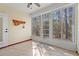 Bright sunroom with tiled floor and multiple windows offering natural light and wooded views at 570 Botany Loop Murrells Inlet # 570, Murrells Inlet, SC 29576
