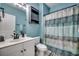 Stylish bathroom with blue walls, modern fixtures, and a patterned shower curtain at 5825 Catalina Dr. # 1133, North Myrtle Beach, SC 29582