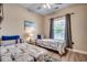 Comfortable bedroom with two twin beds, a ceiling fan, and a window at 5825 Catalina Dr. # 1133, North Myrtle Beach, SC 29582