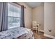 Serene bedroom featuring a comfortable bed, window, and a quaint writing desk at 5825 Catalina Dr. # 1133, North Myrtle Beach, SC 29582