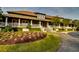 Beautiful clubhouse exterior featuring lush landscaping and inviting entrance at 5825 Catalina Dr. # 1133, North Myrtle Beach, SC 29582