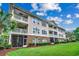 Attractive building with multiple balconies overlooking a well-manicured lawn and landscaping at 5825 Catalina Dr. # 1133, North Myrtle Beach, SC 29582