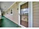 Inviting condo entrance with secure door and exterior hallway at 5825 Catalina Dr. # 1133, North Myrtle Beach, SC 29582