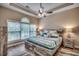 Comfortable main bedroom with a tray ceiling, ceiling fan, and large window with natural light at 5825 Catalina Dr. # 1133, North Myrtle Beach, SC 29582