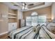 Comfortable bedroom with a tray ceiling, ceiling fan, and ample natural light at 5825 Catalina Dr. # 1133, North Myrtle Beach, SC 29582