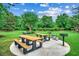Outdoor picnic area with multiple tables and grills, surrounded by a grassy lawn at 5825 Catalina Dr. # 1133, North Myrtle Beach, SC 29582