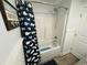 Cozy bathroom with tub and whale-themed shower curtain at 6001 - 1268 S Kings Hwy., Myrtle Beach, SC 29575