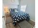 Comfortable bedroom features whale-themed bedding and stylish decor at 6001 - 1268 S Kings Hwy., Myrtle Beach, SC 29575