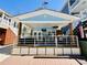 Charming blue beach house featuring a spacious outdoor patio and appealing coastal design at 6001 - 1268 S Kings Hwy., Myrtle Beach, SC 29575
