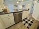 Kitchen island features stainless steel dishwasher, sink and granite countertops at 6001 - 1268 S Kings Hwy., Myrtle Beach, SC 29575