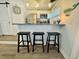 Bright kitchen features stainless steel appliances, granite countertops, and a bar area with seating at 6001 - 1268 S Kings Hwy., Myrtle Beach, SC 29575