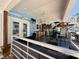 Covered patio features a wet bar, dining area, tv, and stairway to rooftop deck at 6001 - 1268 S Kings Hwy., Myrtle Beach, SC 29575