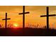 A beautiful sunset over the horizon with three silhouetted crosses in the foreground at 6001 - 1268 S Kings Hwy., Myrtle Beach, SC 29575