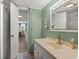 Functional bathroom featuring a vanity with storage and shower, with view to dining area at 6001 - 5010 S Kings Hwy., Myrtle Beach, SC 29575