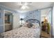 Relaxing bedroom with a floral-patterned bedspread and a message wall at 6001 - 5010 S Kings Hwy., Myrtle Beach, SC 29575