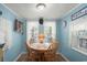 Charming dining area with light blue walls and seating for four around a round table at 6001 - 5010 S Kings Hwy., Myrtle Beach, SC 29575