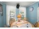 Cozy dining area with blue walls, bright lighting, and seating for four around a wooden table at 6001 - 5010 S Kings Hwy., Myrtle Beach, SC 29575