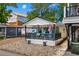 Welcoming single-story home featuring a covered porch, colorful chairs, and easy access with a convenient driveway at 6001 - 5010 S Kings Hwy., Myrtle Beach, SC 29575