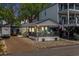 Charming single-story home with a covered porch and a driveway with a trailer parked outside at 6001 - 5010 S Kings Hwy., Myrtle Beach, SC 29575