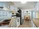 Open kitchen with appliances, adjacent to an eat-in kitchen featuring natural light and seating at 6001 - 5010 S Kings Hwy., Myrtle Beach, SC 29575