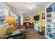 Cozy living room with comfortable seating, bright yellow walls, and a well-lit space for relaxation and entertainment at 6001 - 5010 S Kings Hwy., Myrtle Beach, SC 29575