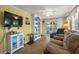 Inviting living room with comfortable seating, sliding glass doors, and a charming atmosphere for relaxation and socializing at 6001 - 5010 S Kings Hwy., Myrtle Beach, SC 29575