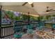 Inviting covered porch with ceiling fans, string lights, and comfortable seating, perfect for outdoor relaxation at 6001 - 5010 S Kings Hwy., Myrtle Beach, SC 29575
