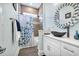 Stylish bathroom featuring a vessel sink, decorative mirror, and shower-tub combo at 6004 Flowerdale Ct., Myrtle Beach, SC 29579