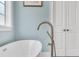Modern bathroom with a freestanding tub and a sleek, modern faucet at 6004 Flowerdale Ct., Myrtle Beach, SC 29579