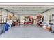 Spacious garage with ample storage, and a variety of organized items, and shelving at 6004 Flowerdale Ct., Myrtle Beach, SC 29579