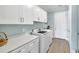 Functional laundry room with modern appliances, ample counter space, and storage cabinets at 6004 Flowerdale Ct., Myrtle Beach, SC 29579