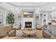 Living room features a fireplace, beach-themed art, and comfortable seating at 6004 Flowerdale Ct., Myrtle Beach, SC 29579