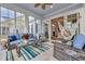 Relaxing sunroom with scenic views, comfortable seating, and a hammock at 6004 Flowerdale Ct., Myrtle Beach, SC 29579