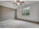 Bright bedroom with a ceiling fan, large window, and soft carpet, offering a comfortable and serene atmosphere at 6013 Blease Ct., Myrtle Beach, SC 29588