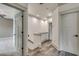Hallway with hardwood floors, white trim, and multiple doorways that provides a seamless flow between rooms at 6013 Blease Ct., Myrtle Beach, SC 29588