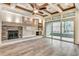 Living room featuring hardwood-style tile, a fireplace, and sliding glass doors to the outdoors at 6013 Blease Ct., Myrtle Beach, SC 29588