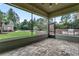 Screened porch features outdoor seating, a brick fireplace, a stone kitchen and views of the manicured lawn at 6013 Blease Ct., Myrtle Beach, SC 29588