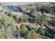 Aerial view of home with large, private lot and mature trees, on water at 61 Lakewood Dr., Andrews, SC 29510