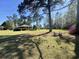 Beautiful backyard with mature trees and lush green lawn at 61 Lakewood Dr., Andrews, SC 29510