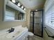 Bathroom features a new sink, tile shower with glass doors, and a large vanity mirror at 61 Lakewood Dr., Andrews, SC 29510