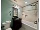 Bathroom features dark wood vanity, tile floors and bright bathtub shower combo at 61 Lakewood Dr., Andrews, SC 29510